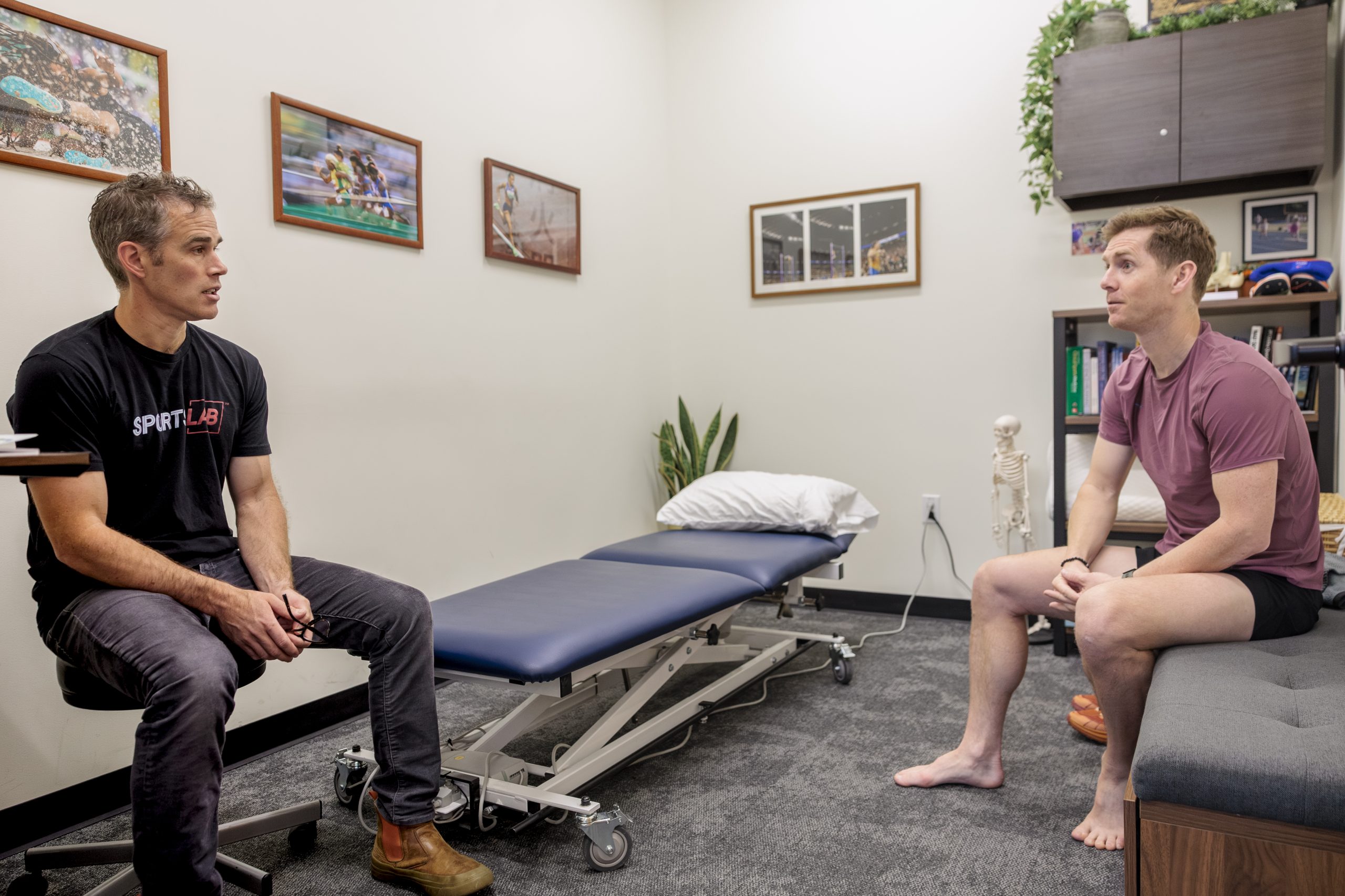 SportsLab physical therapy team working with a client in the Portland facility